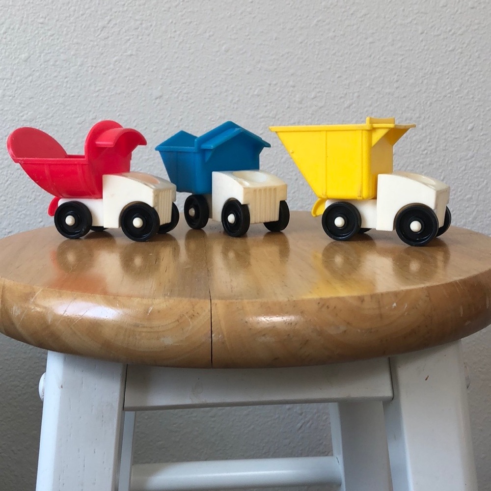 3 vintage Fisher Price dump trucks, made in USA